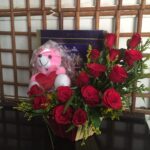 Basket of roses with teddy and chocolates